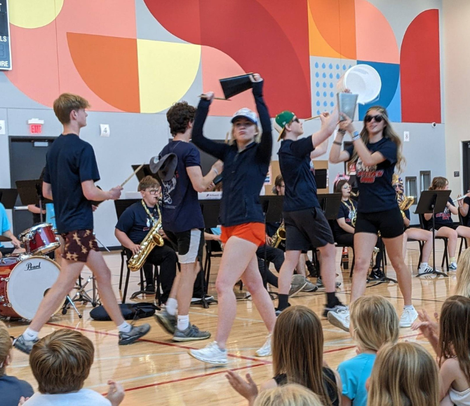 group of students performing on stage